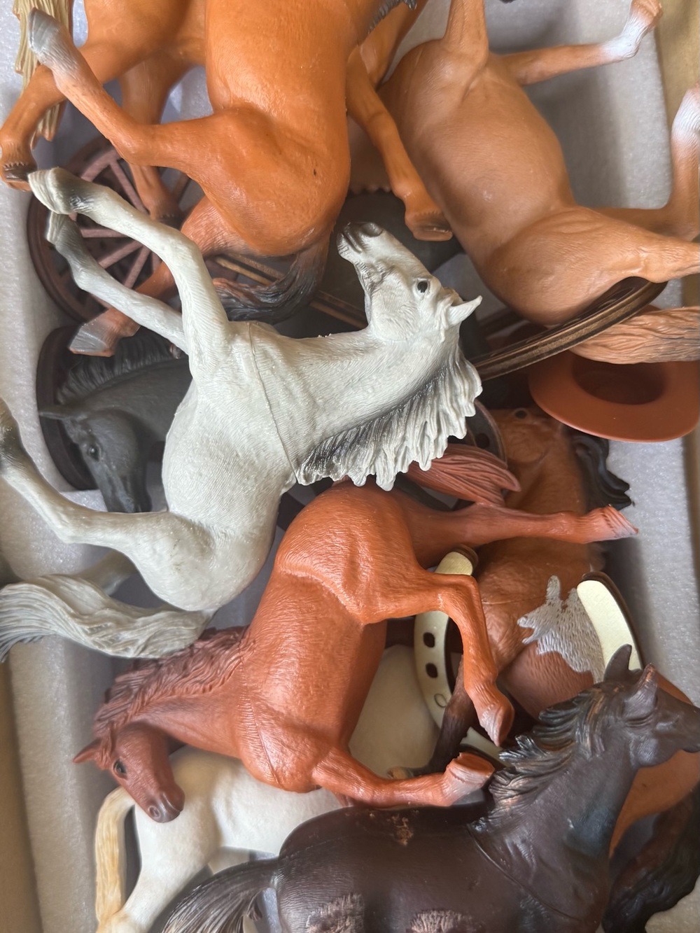 11 plastic horses